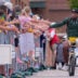 Green Bay Packers wide receiver Matthew Golden slaps hands with fans as he rides a bicycle to practice on Friday, July 31, 2026, at Lambeau Field in Green Bay, Wisconsin.