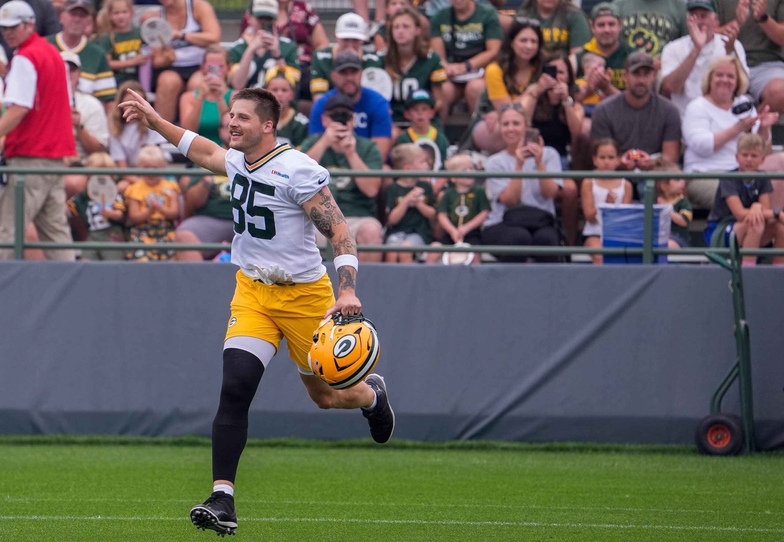 Green Bay Packers tight end Tucker Kraft (85) hypes up the crowd during practice on Friday, July 31, 2026, at Ray Nitschke Field in Ashwaubenon, Wisconsin.