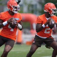 Browns quarterbacks Deshaun Watson and Shedeur Sanders drop back to pass during training camp, July, 31, 2026, in Berea.