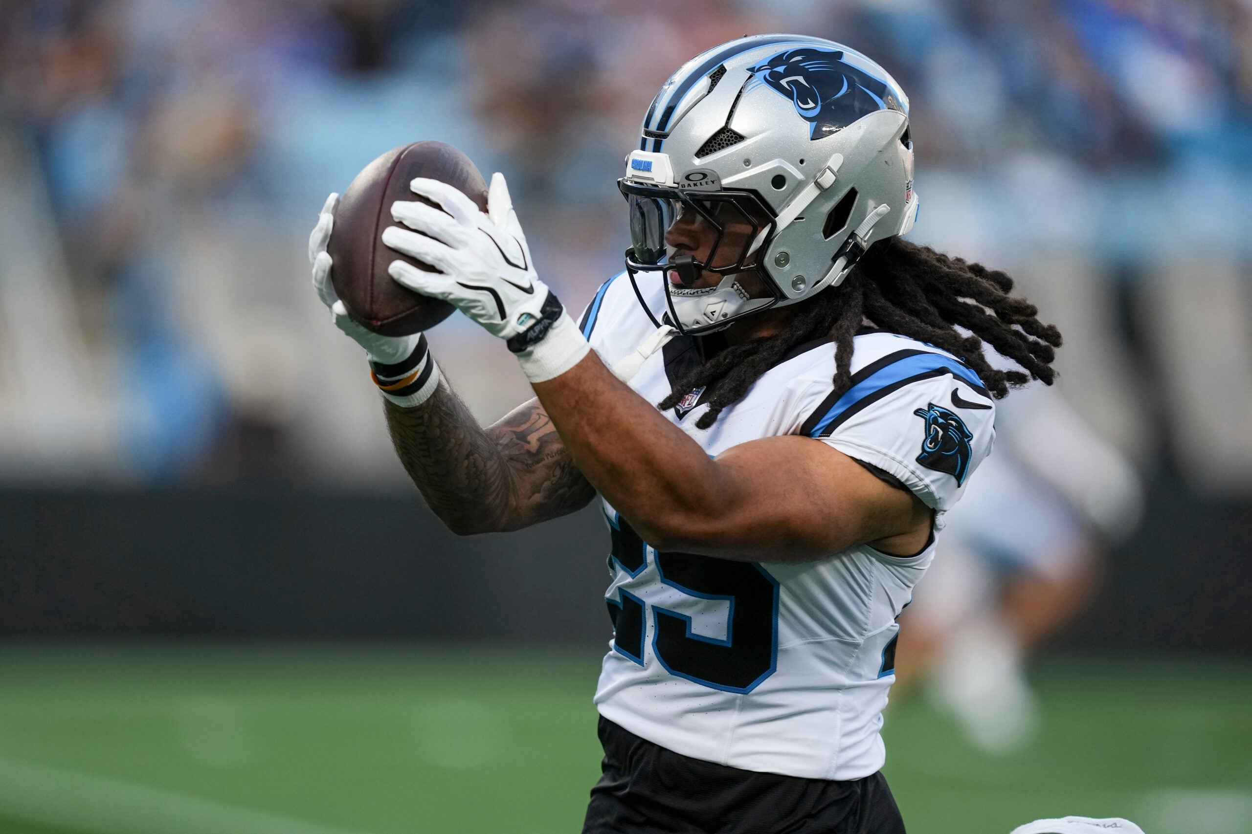Jul 31, 2026; Charlotte, NC, USA; Carolina Panthers running back Jonathon Brooks (25) catches the ball during Fanfest at Bank of America Stadium.