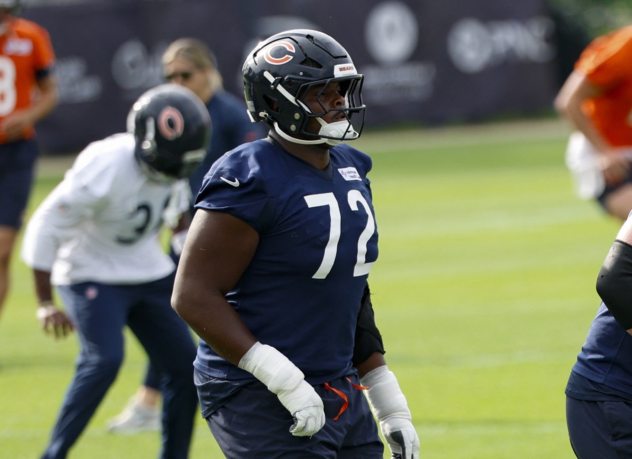 Jul 31, 2026; Lake Forest, IL, USA; Chicago Bears offensive tackle Kiran Amegadjie (72) warms up during Training Camp at Halas Hall.