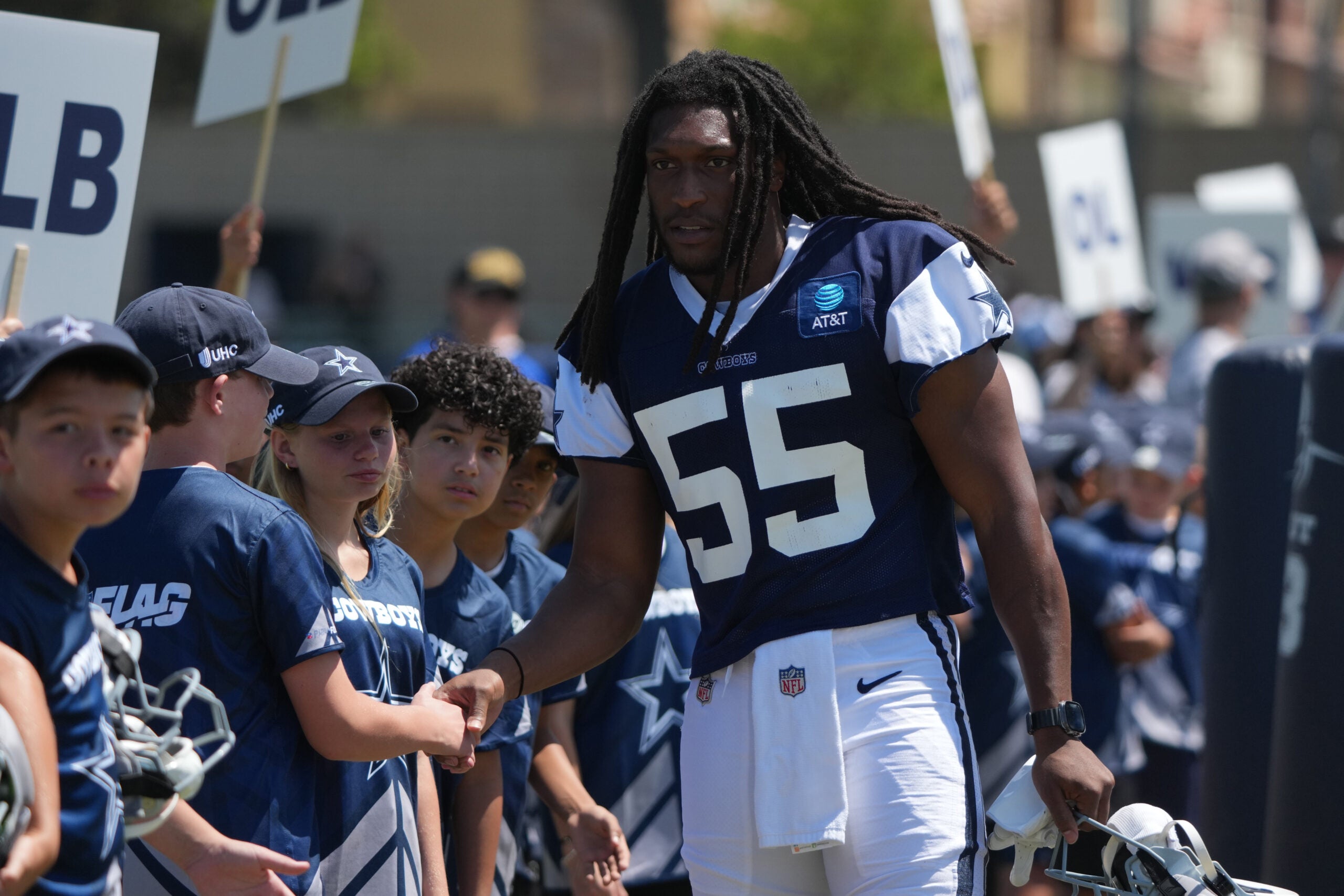 Aug 1, 2026; Oxnard, CA, USA; Dallas Cowboys linebacker Jaishawn Barham (55) greets fans at training camp at River Ridge Playing Fields.