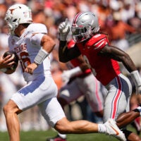 Ohio State Buckeyes linebacker Arvell Reese (8) pursues Texas Longhorns quarterback Arch Manning (16) during the NCAA football game at Ohio Stadium on Aug. 30, 2025.