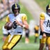 Aug 03, 2026; Latrobe, PA, USA; Pittsburgh Steelers quarterbacks Aaron Rodgers (8) looks to throw a pass as Will Howard (18) watches during a practice session at Training camp at Saint Vincent College.