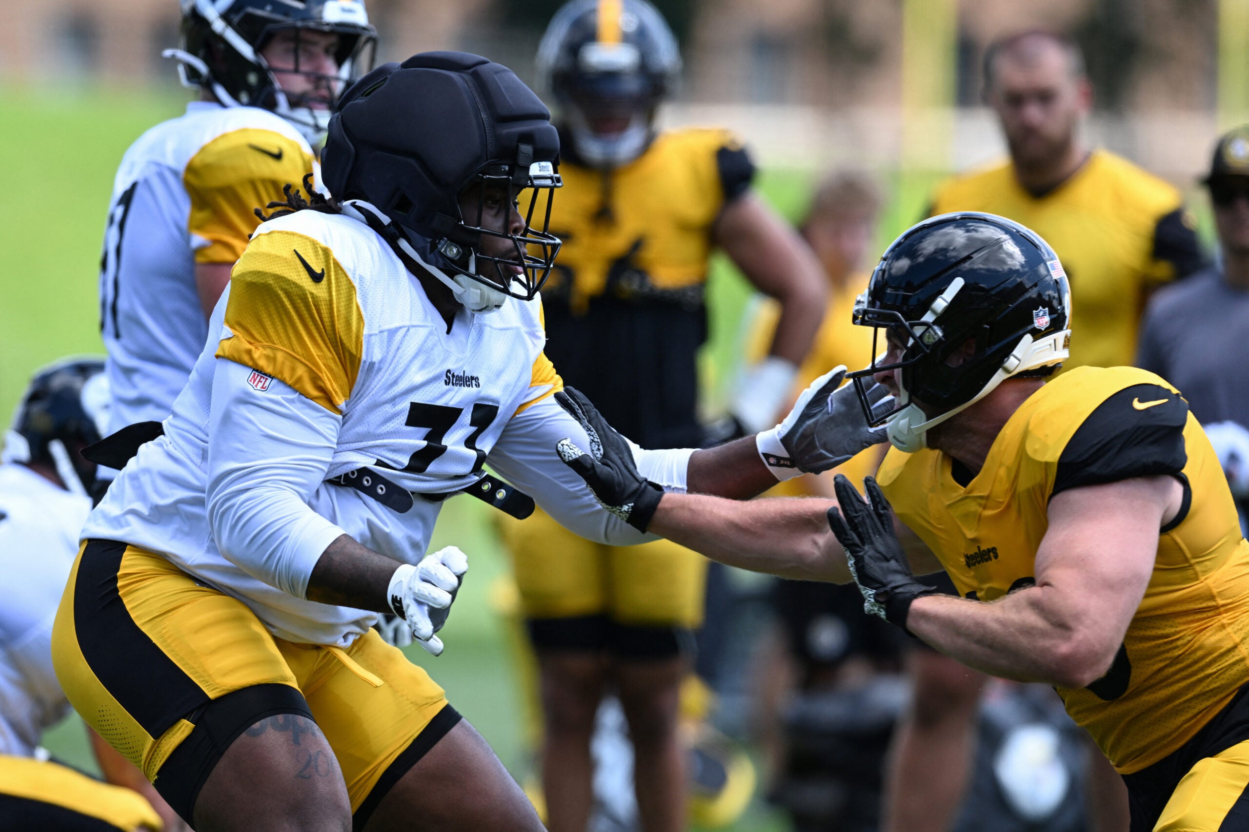 Aug 03, 2026; Latrobe, PA, USA; Pittsburgh Steelers offensive tackle Max Iheanachor (71) blocks linebacker T.J. Watt (90.)during a practice session at Training camp at Saint Vincent College.