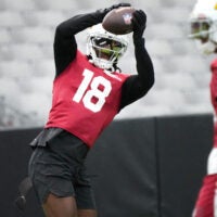 Arizona Cardinals receiver Marvin Harrison Jr. (18) catches a pass during training camp at State Farm Stadium in Glendale on July 26, 2026.