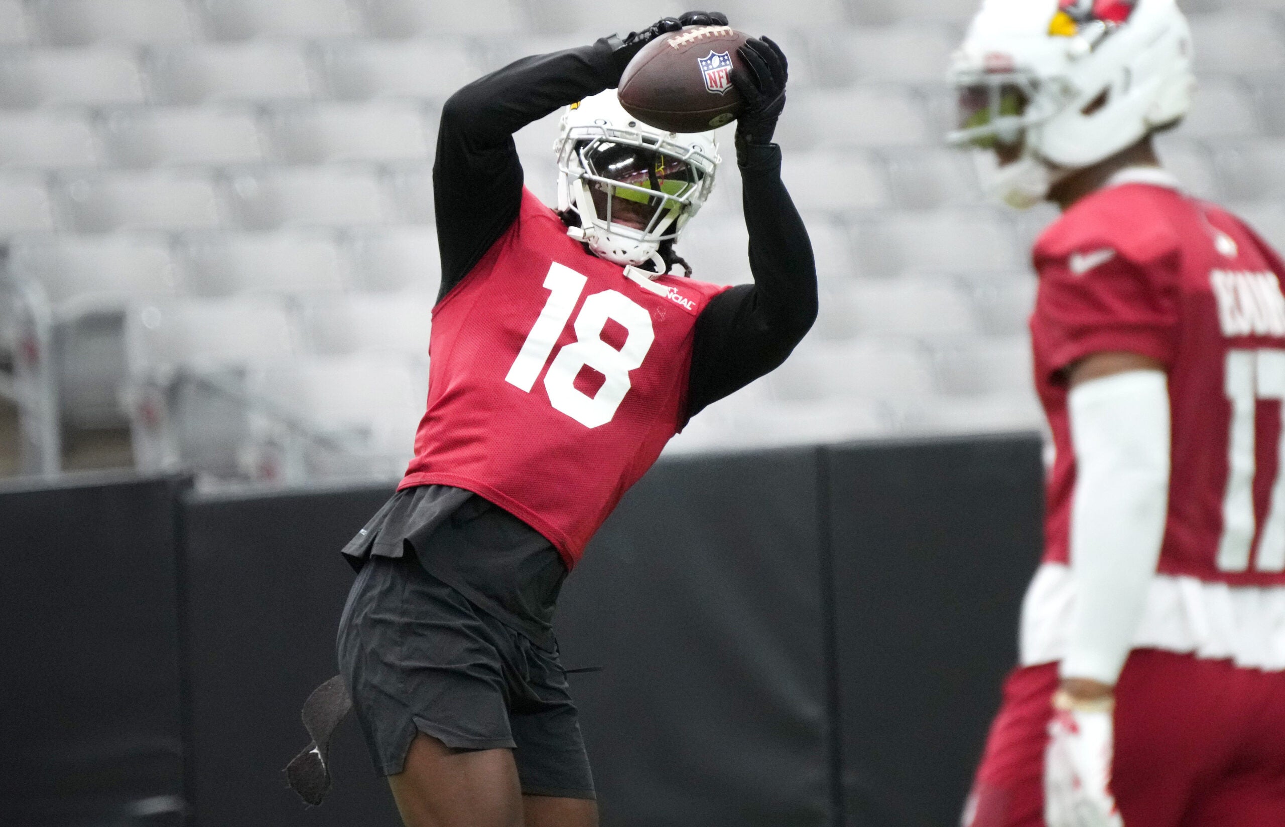Arizona Cardinals receiver Marvin Harrison Jr. (18) catches a pass during training camp at State Farm Stadium in Glendale on July 26, 2026.