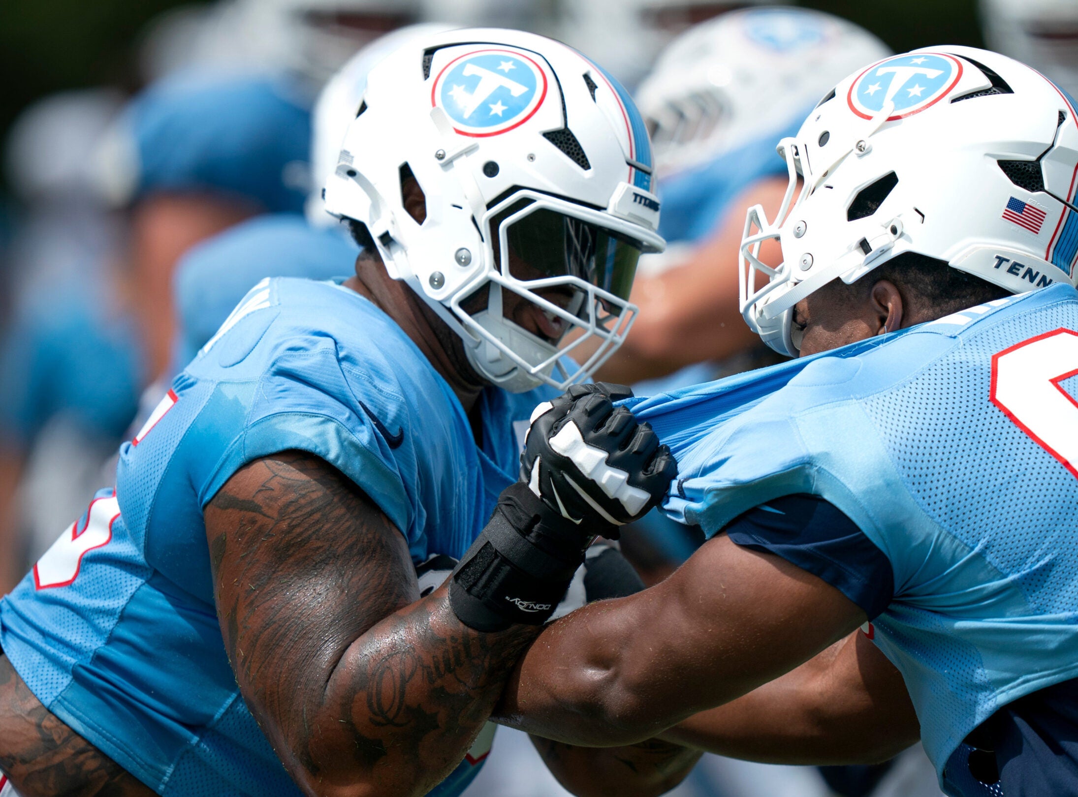JC Latham Tennessee Titans right tackle Darnell Wright contract NFL news