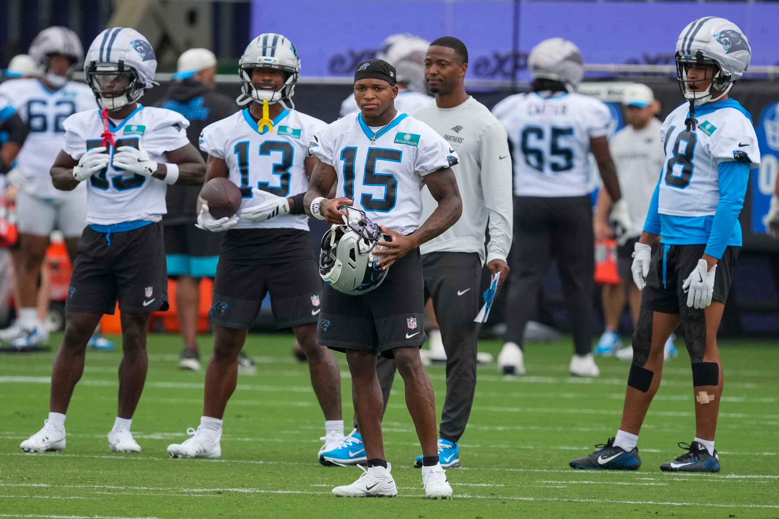 Aug 4, 2026; Charlotte, NC, USA; Carolina Panthers wide receiver Jimmy Horn Jr. (15) and receivers during training camp at Bank of America Stadium.