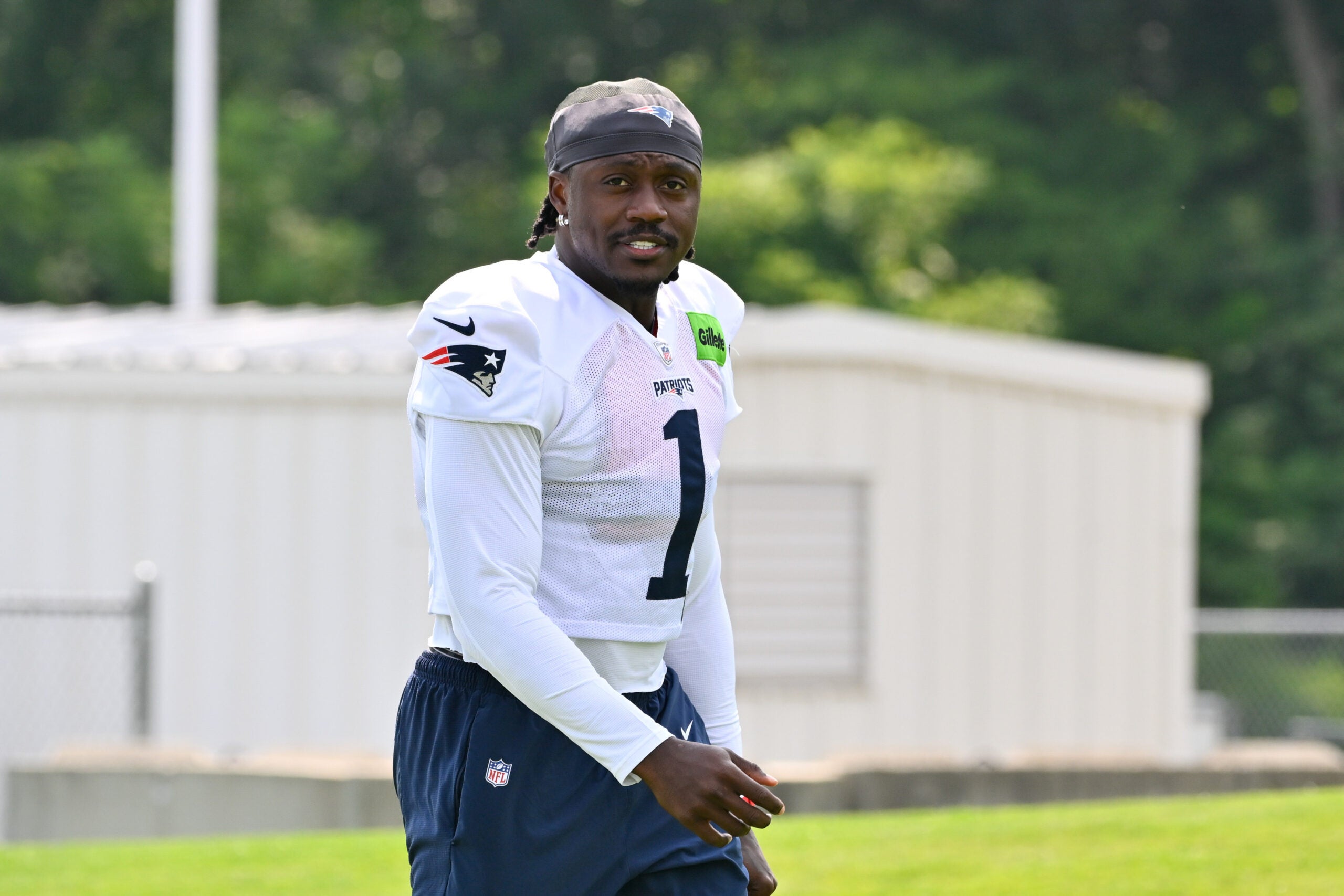 Jul 28, 2026; Foxborough, MA, USA; New England Patriots wide receiver A.J. Brown (1) walks to practice for training camp at Gillette Stadium.
