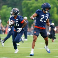 Aug 5, 2026; Lake Forest, IL, USA; Chicago Bears running back Salvon Ahmed (36) and running back Roschon Johnson (23) run on the field during training camp at Halas Hall.
