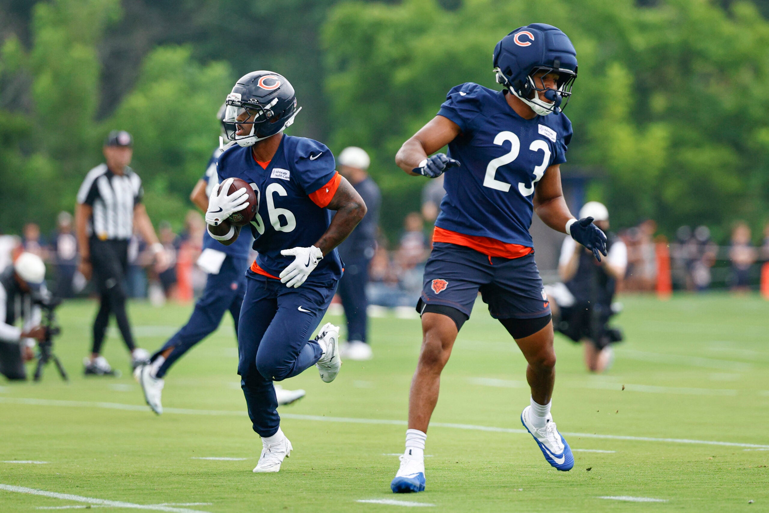 Aug 5, 2026; Lake Forest, IL, USA; Chicago Bears running back Salvon Ahmed (36) and running back Roschon Johnson (23) run on the field during training camp at Halas Hall.
