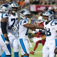 Aug 6, 2026; Canton, Ohio, USA; Carolina Panthers running back AJ Dillon (28) celebrates with teammates after scoring a touchdown against the Arizona Cardinals in the second quarter at Tom Benson Hall of Fame Stadium.