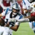 Aug 6, 2026; Canton, Ohio, USA; Carolina Panthers quarterback Haynes King (16) runs the ball against Arizona Cardinals linebacker Austin Keys (53) at Tom Benson Hall of Fame Stadium.