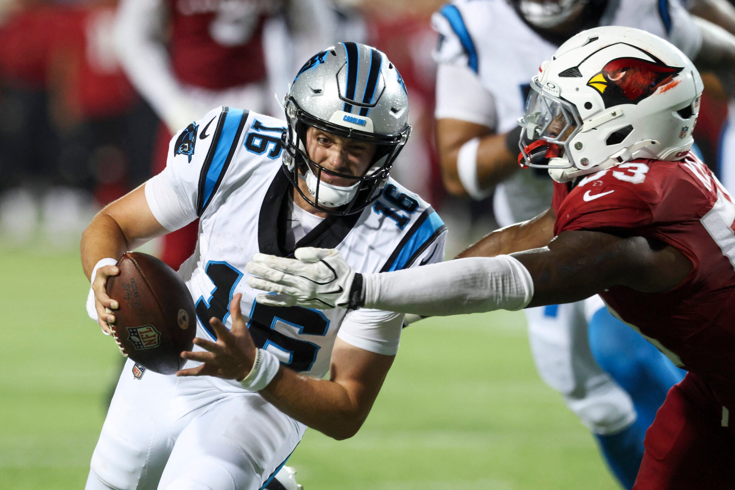 Aug 6, 2026; Canton, Ohio, USA; Carolina Panthers quarterback Haynes King (16) runs the ball against Arizona Cardinals linebacker Austin Keys (53) at Tom Benson Hall of Fame Stadium.