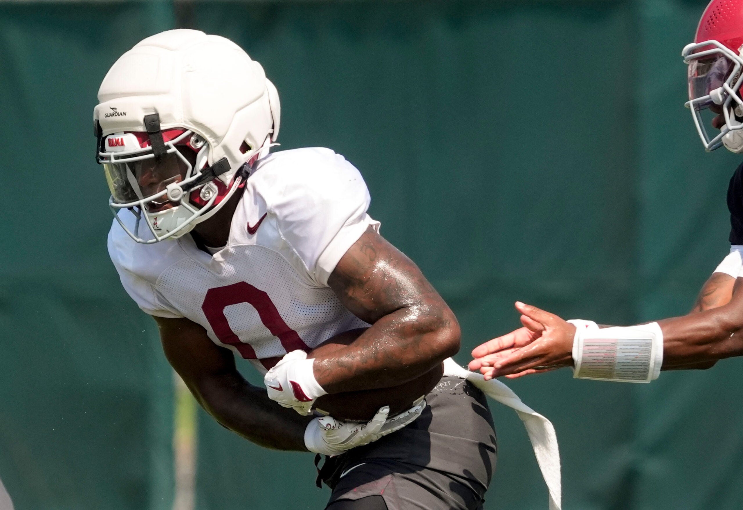 Aug. 7, 2026; Tuscaloosa, AL, USA; Running back AK Dear takes a handoff during practice for the Alabama Crimson Tide.