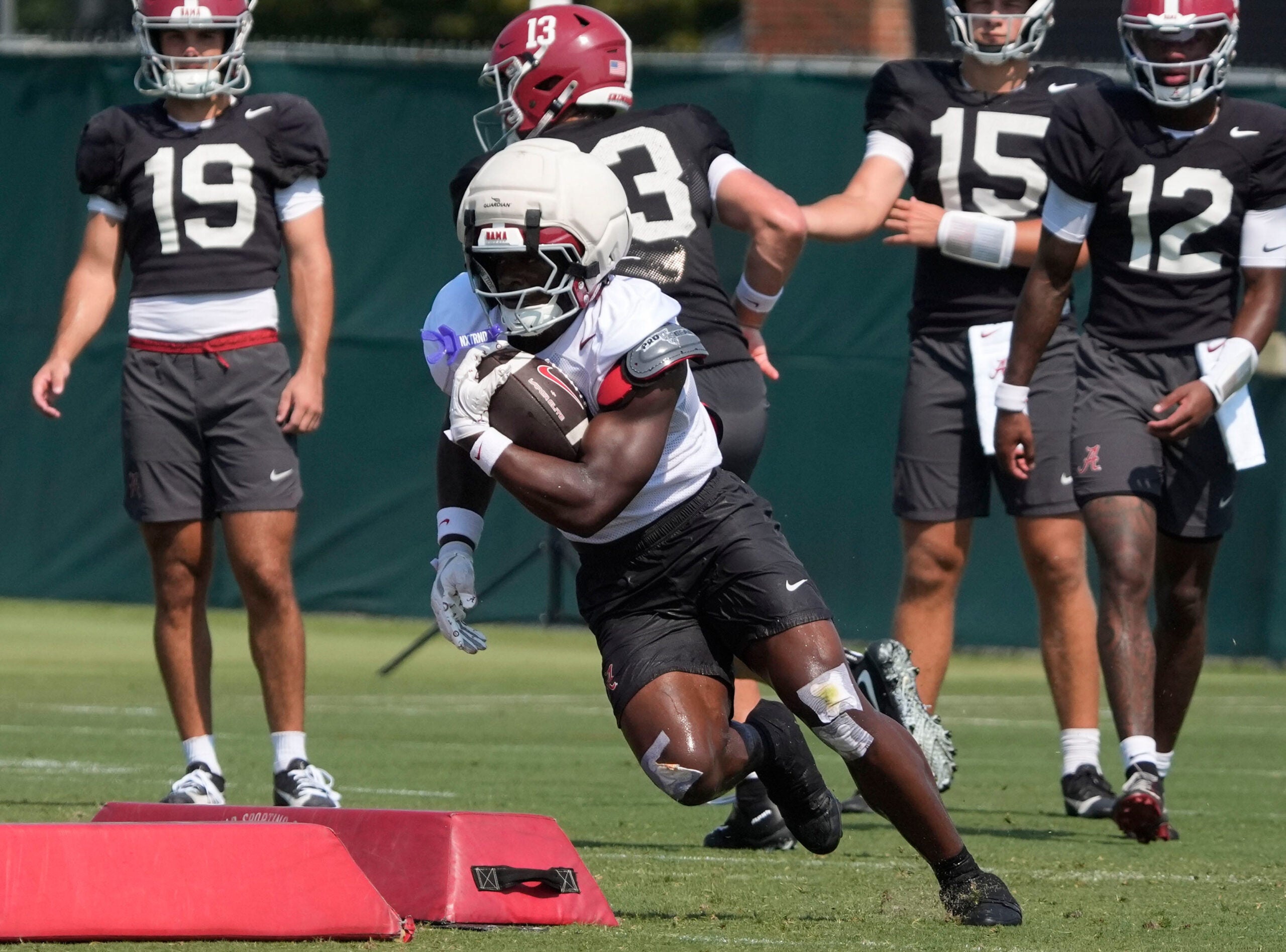 Aug. 7, 2026; Tuscaloosa, AL, USA; Running back EJ Crowell (13) makes a move as he runs the ball during practice for the Alabama Crimson Tide.