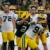 Green Bay Packers wide receiver Christian Watson (9) catches a pass with pressure from cornerback Brandon Cisse (2) during Green Bay Packers Family Night on Aug. 7, 2026, at Lambeau Field in Green Bay, Wis.