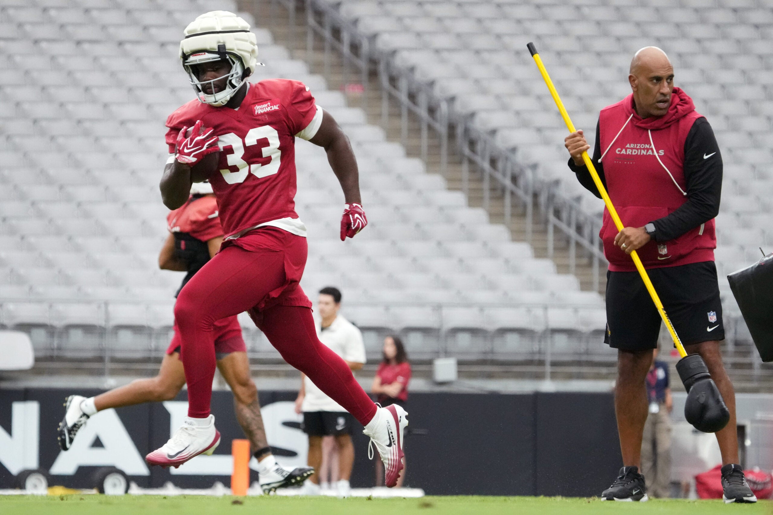 Arizona Cardinals running back Trey Benson (33) practices during training camp at State Farm Stadium in Glendale on July 26, 2026.