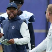 Aug 11, 2026; Woodland Hills, CA, USA; Dallas Cowboys defensive coordinator Christian Parker (left) and Los Angeles Rams head coach Sean McVay react during a joint practice at the Rams Practice Facility.
