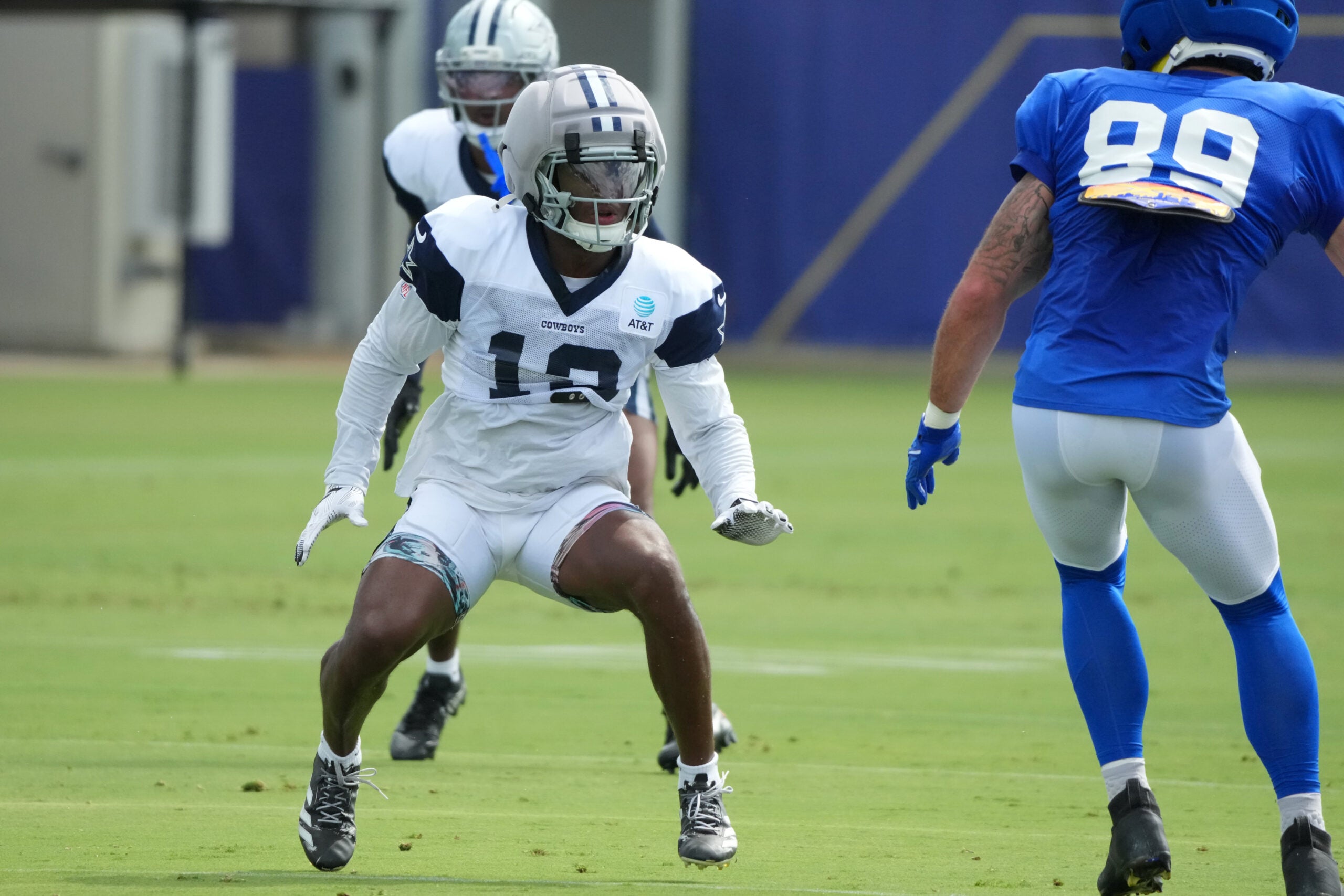 Aug 11, 2026; Woodland Hills, CA, USA; Dallas Cowboys safety Caleb Downs (13) defends against Los Angeles Rams tight end Tyler Higbee (89) during a joint practice at the Rams Practice Facility.