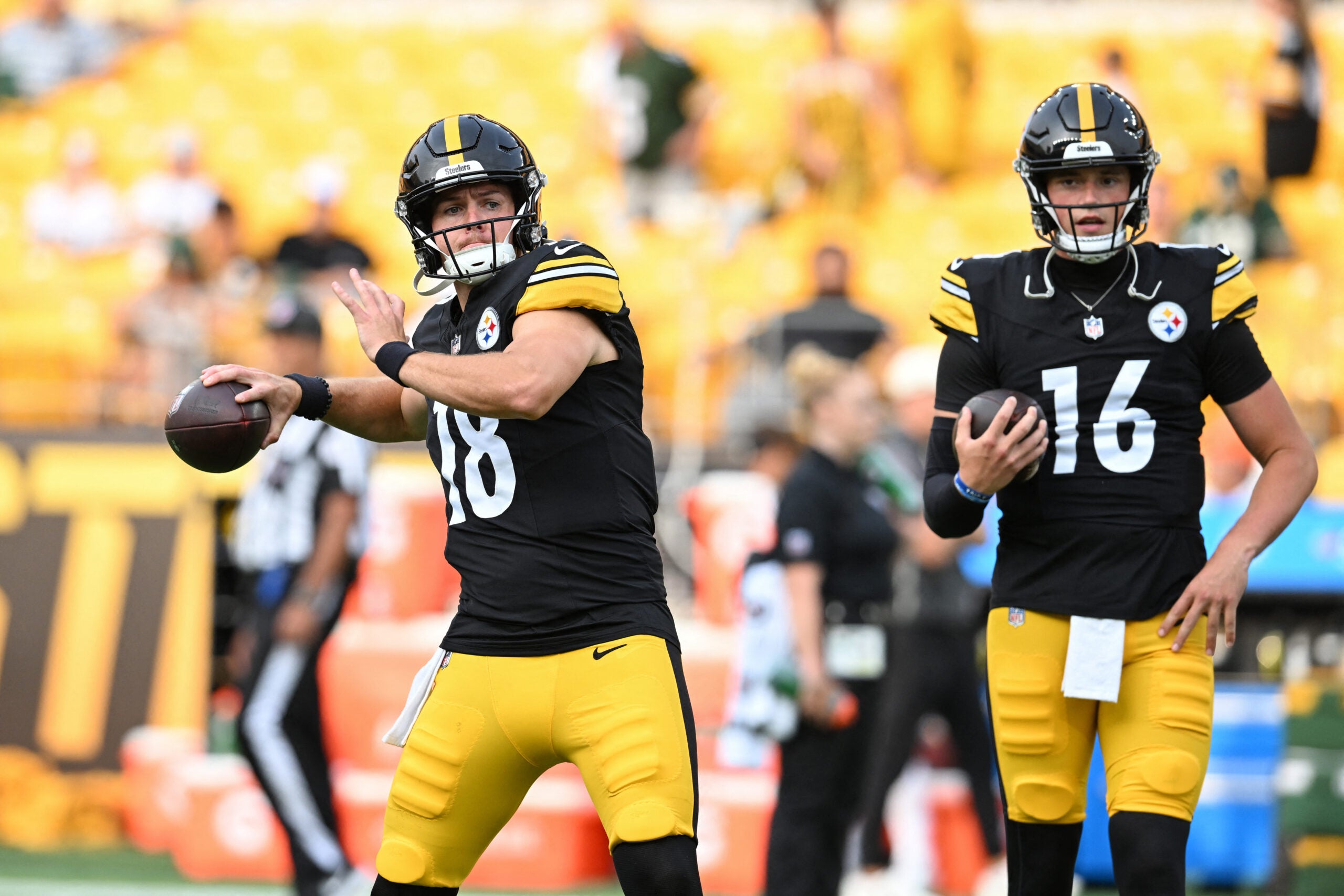 Aug 13, 2026; Pittsburgh, Pennsylvania, USA; Pittsburgh Steelers quarterbacks Will Howard (18) and Drew Allar (16) warm up for a pre-season game against the Green Bay Packers at Acrisure Stadium.