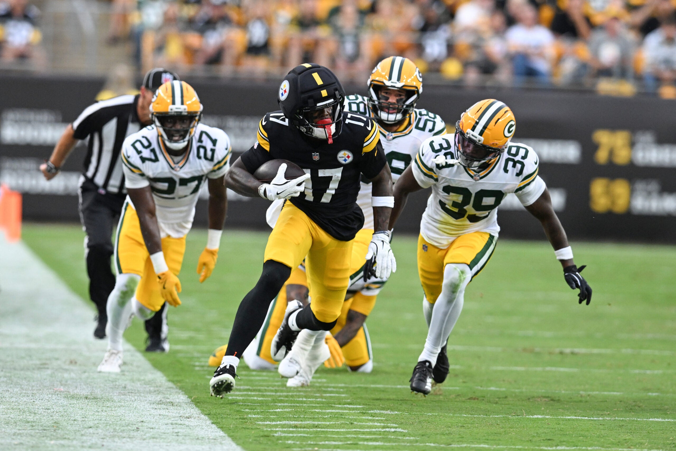 Aug 13, 2026; Pittsburgh, Pennsylvania, USA; Pittsburgh Steelers wide receiver Germie Bernard (17) avoids Green Bay Packers safety Murvin Kenion III (39) during the first half of a game against the Green Bay Packers at Acrisure Stadium.