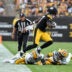 Aug 13, 2026; Pittsburgh, Pennsylvania, USA; Pittsburgh Steelers wide receiver Germie Bernard (17) jumps over Green Bay Packers safety Kitan Oladapo (27) during the first half of a game against the Green Bay Packers at Acrisure Stadium.