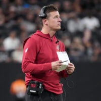 Aug 13, 2026; Paradise, Nevada, USA; Arizona Cardinals head coach Mike LaFleur watches from the sidelines against the Las Vegas Raiders in the second half at Allegiant Stadium.