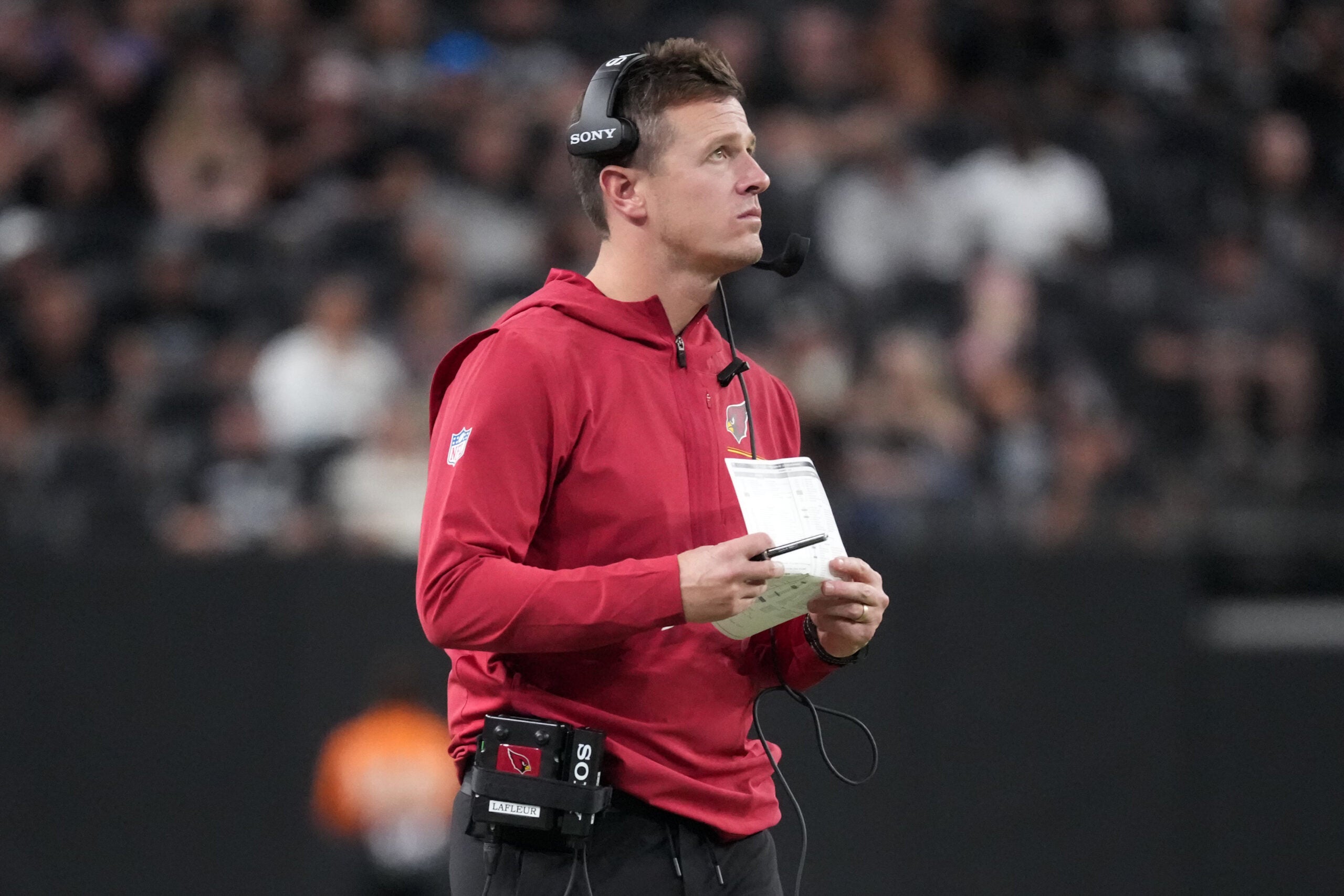 Aug 13, 2026; Paradise, Nevada, USA; Arizona Cardinals head coach Mike LaFleur watches from the sidelines against the Las Vegas Raiders in the second half at Allegiant Stadium.