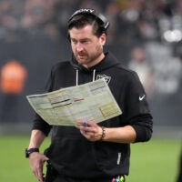 Las Vegas Raiders offensive coordinator Andrew Janocko running back Mike Washington Jr.