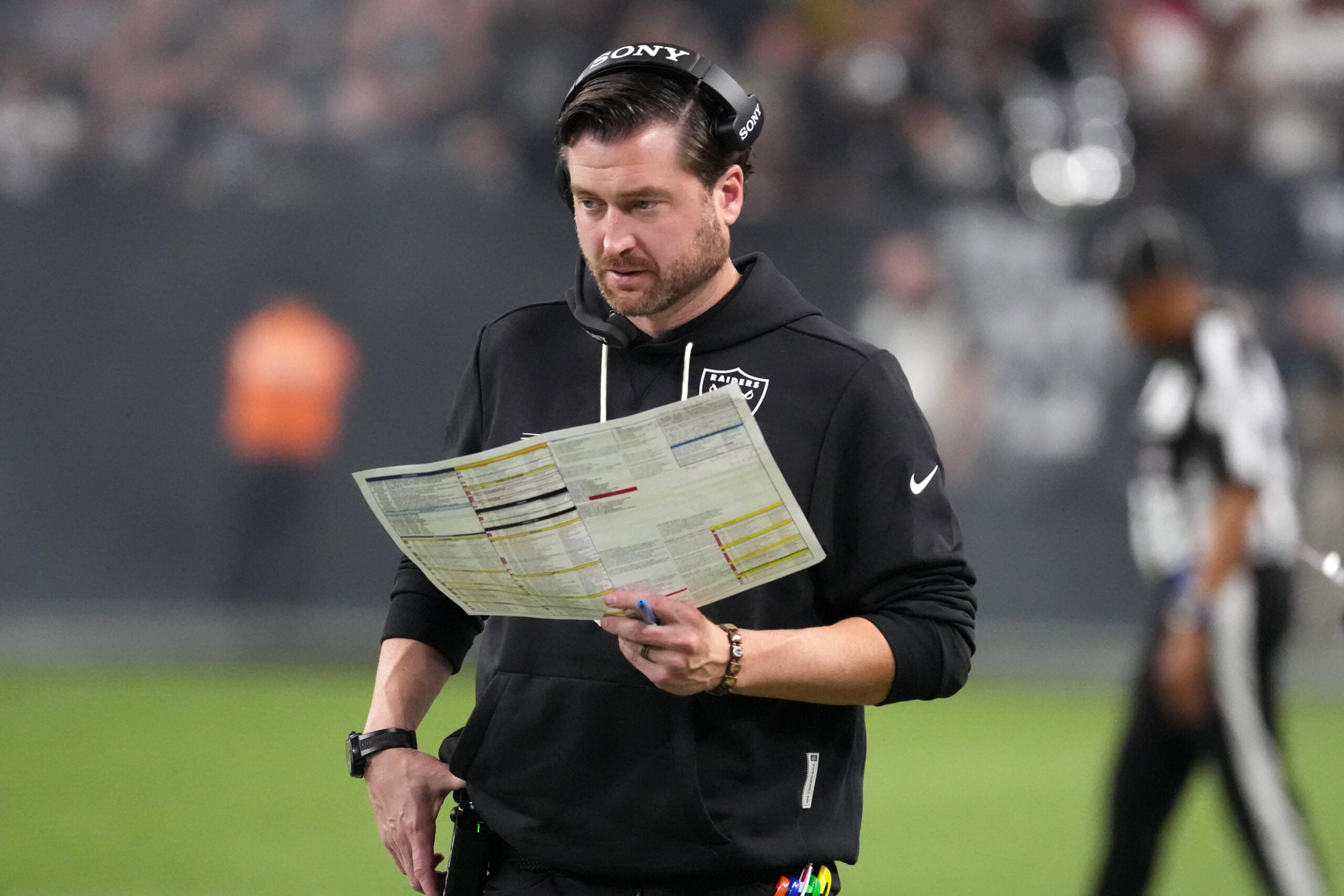 Las Vegas Raiders offensive coordinator Andrew Janocko running back Mike Washington Jr.