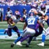Aug 15, 2026; East Rutherford, New Jersey, USA; Minnesota Vikings running back Aaron Jones Sr. (33) carries the ball against the New York Giants during the first quarter at MetLife Stadium.