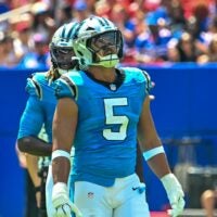 Aug 15, 2026; Orchard Park, New York, USA; Carolina Panthers linebacker Jaelan Phillips (5) watches a replay in the first quarter against the Buffalo Bills at the New Highmark Stadium.
