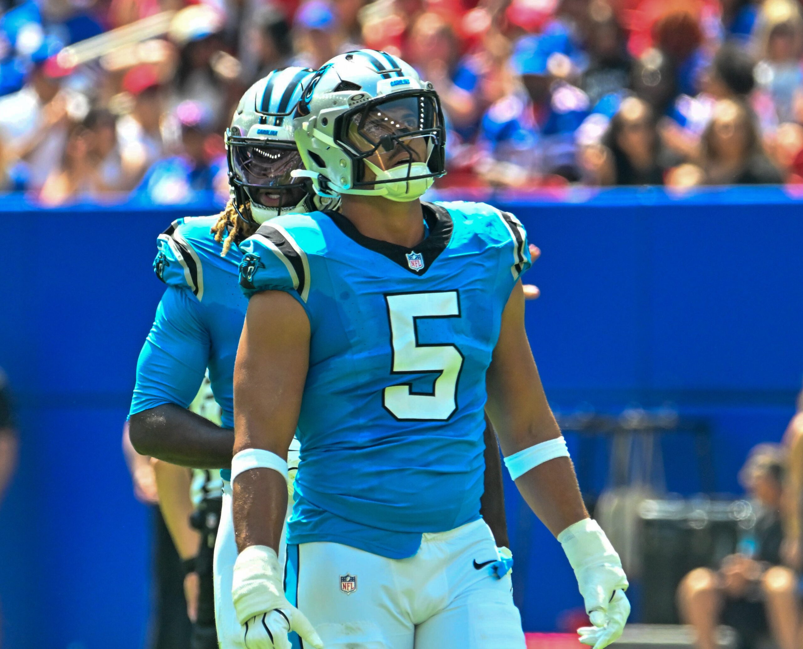 Aug 15, 2026; Orchard Park, New York, USA; Carolina Panthers linebacker Jaelan Phillips (5) watches a replay in the first quarter against the Buffalo Bills at the New Highmark Stadium.