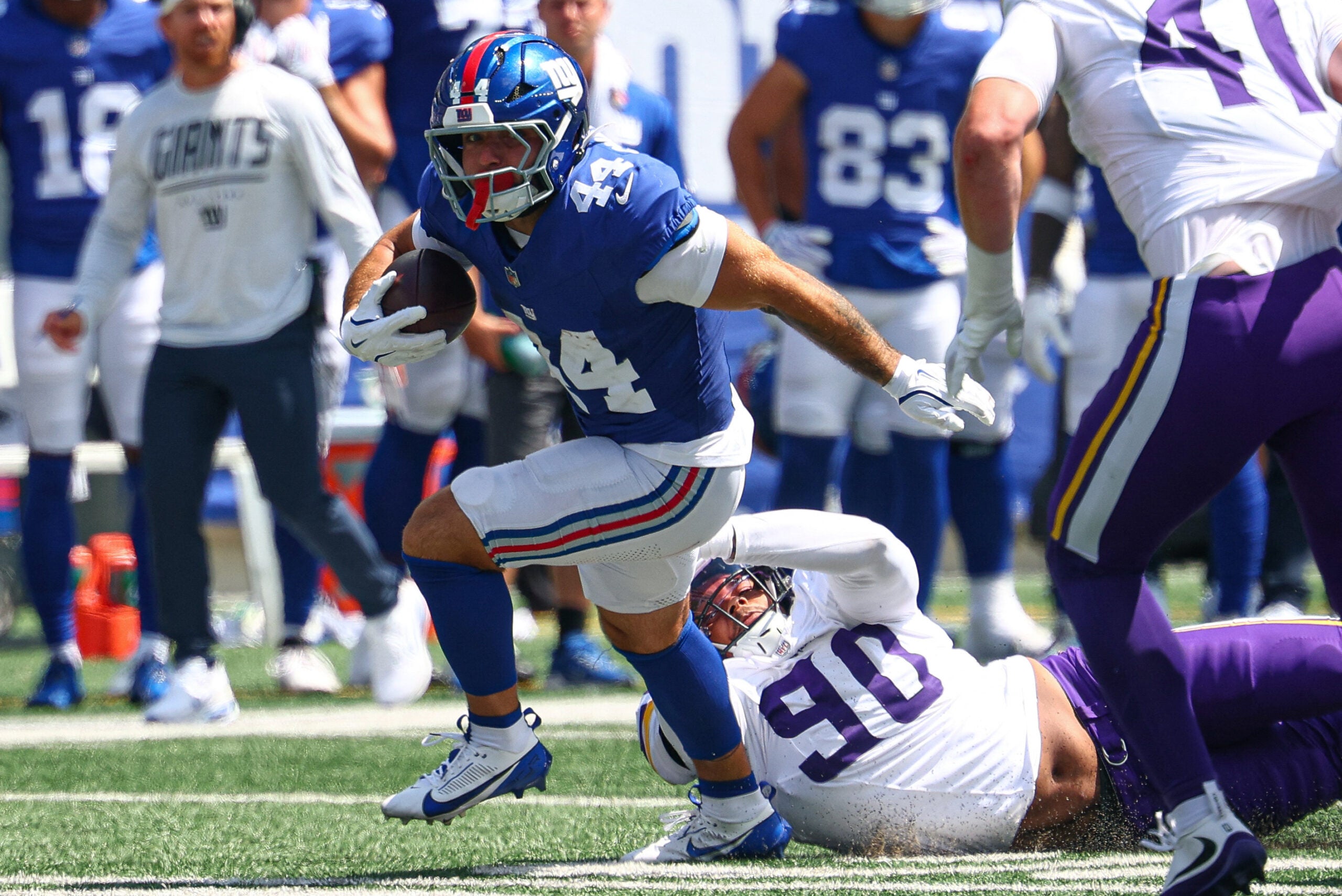 Aug 15, 2026; East Rutherford, New Jersey, USA; New York Giants running back Cam Skattebo (44) carries the ball as Minnesota Vikings defensive end Tyrion Ingram-Dawkins (90) tackles during the first half at MetLife Stadium.