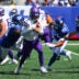 Aug 15, 2026; East Rutherford, New Jersey, USA; Minnesota Vikings quarterback J.J. McCarthy (9) is sacked by New York Giants defensive tackle Darius Alexander (91) during the first half at MetLife Stadium.