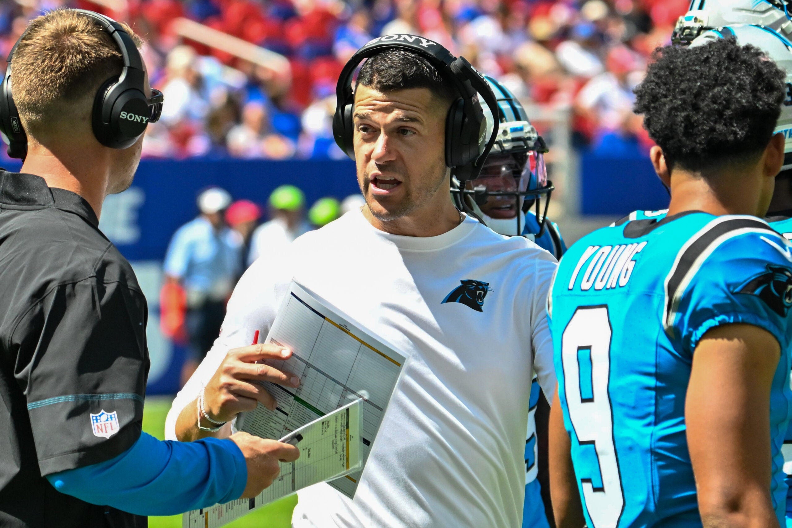 Aug 15, 2026; Orchard Park, New York, USA; Carolina Panthers head coach Dave Canales has a word with an assistant in the second quarter game against the Buffalo Bills at the New Highmark Stadium.