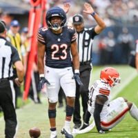 Aug 15, 2026; Chicago, Illinois, USA; Chicago Bears running back Roschon Johnson (23) reacts after gaining a first down against the Cleveland Browns during the first half at Soldier Field.