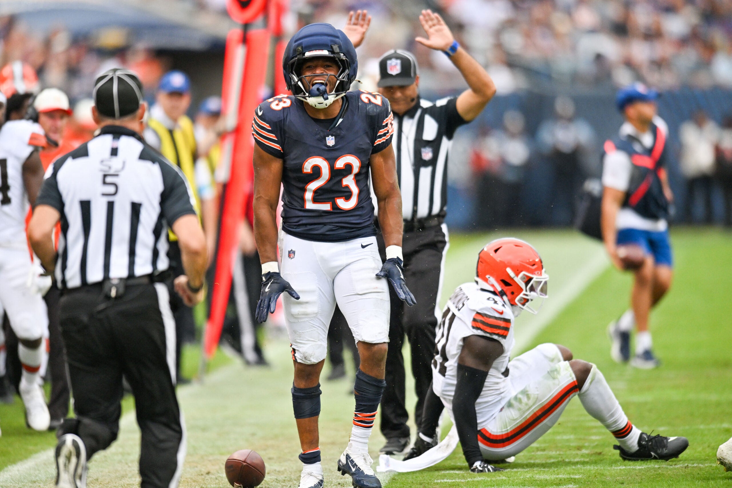 Aug 15, 2026; Chicago, Illinois, USA; Chicago Bears running back Roschon Johnson (23) reacts after gaining a first down against the Cleveland Browns during the first half at Soldier Field.