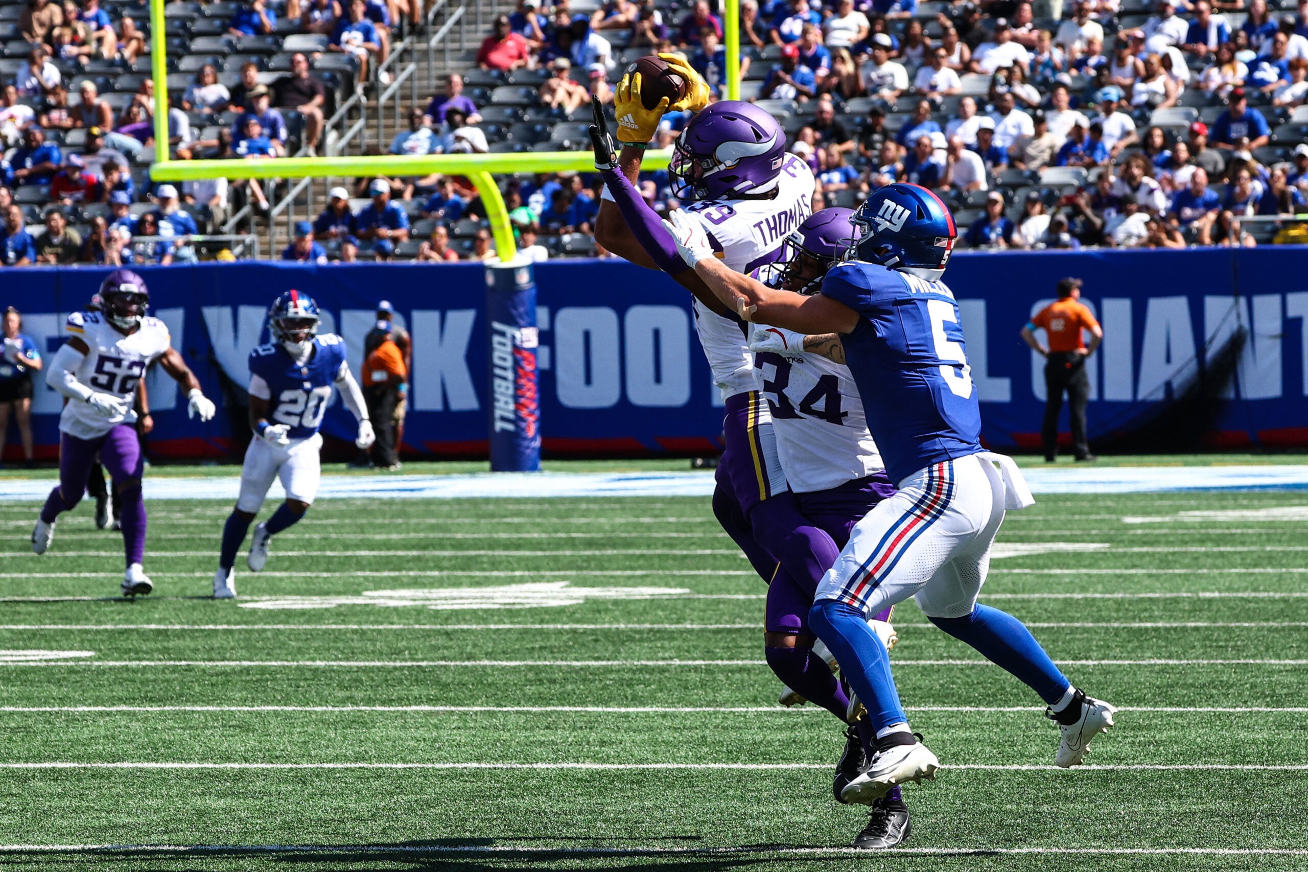 Aug 15, 2026; East Rutherford, New Jersey, USA; Minnesota Vikings safety Jacob Thomas (39) intercepts a pass intended for New York Giants wide receiver Ryan Miller (5) during the second half at MetLife Stadium.