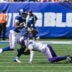 Aug 15, 2026; East Rutherford, New Jersey, USA; New York Giants running back Eric Gray (20) runs after a catch as Minnesota Vikings cornerback Dwight McGlothern (6) defends during the first half at MetLife Stadium.