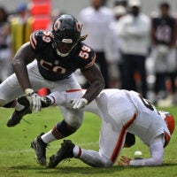 Aug 15, 2026; Chicago, Illinois, USA; Chicago Bears defensive end Jamree Kromah (59) sacks Cleveland Browns quarterback Dillon Gabriel (6) during the second half at Soldier Field.