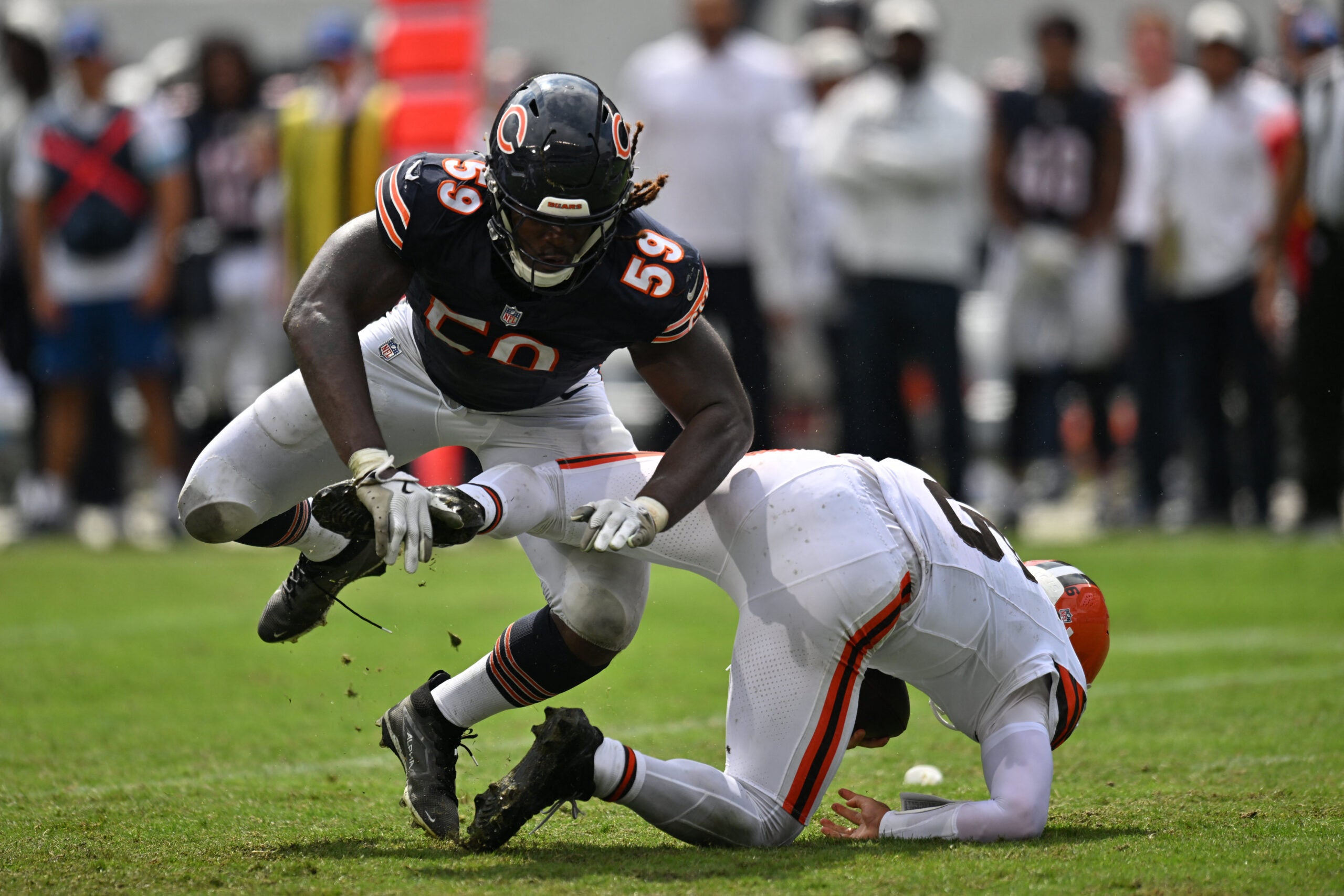 Aug 15, 2026; Chicago, Illinois, USA; Chicago Bears defensive end Jamree Kromah (59) sacks Cleveland Browns quarterback Dillon Gabriel (6) during the second half at Soldier Field.