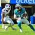 Aug 15, 2026; Orchard Park, New York, USA; Carolina Panthers running back Anthony Tyus III (34) tries to avoid Buffalo Bills linebacker Jimmy Ciarlo (35) after making a catch in the fourth quarter at the New Highmark Stadium.