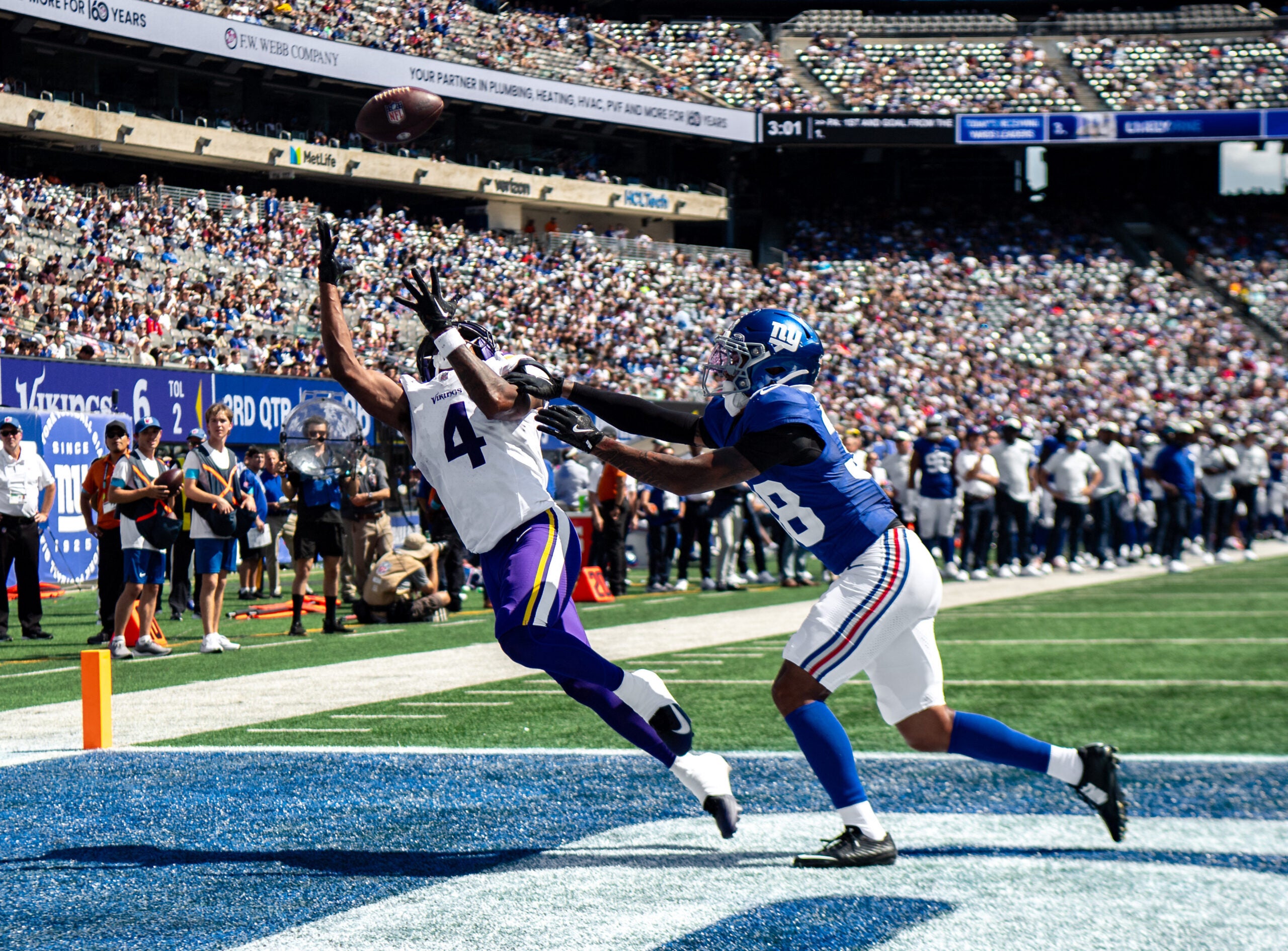 Aug 15, 2026; East Rutherford, New Jersey, USA; Minnesota Vikings wide receiver Myles Price (4) catches a pass for a touchdown as New York Giants cornerback Korie Black (38) defends during the first half at MetLife Stadium.