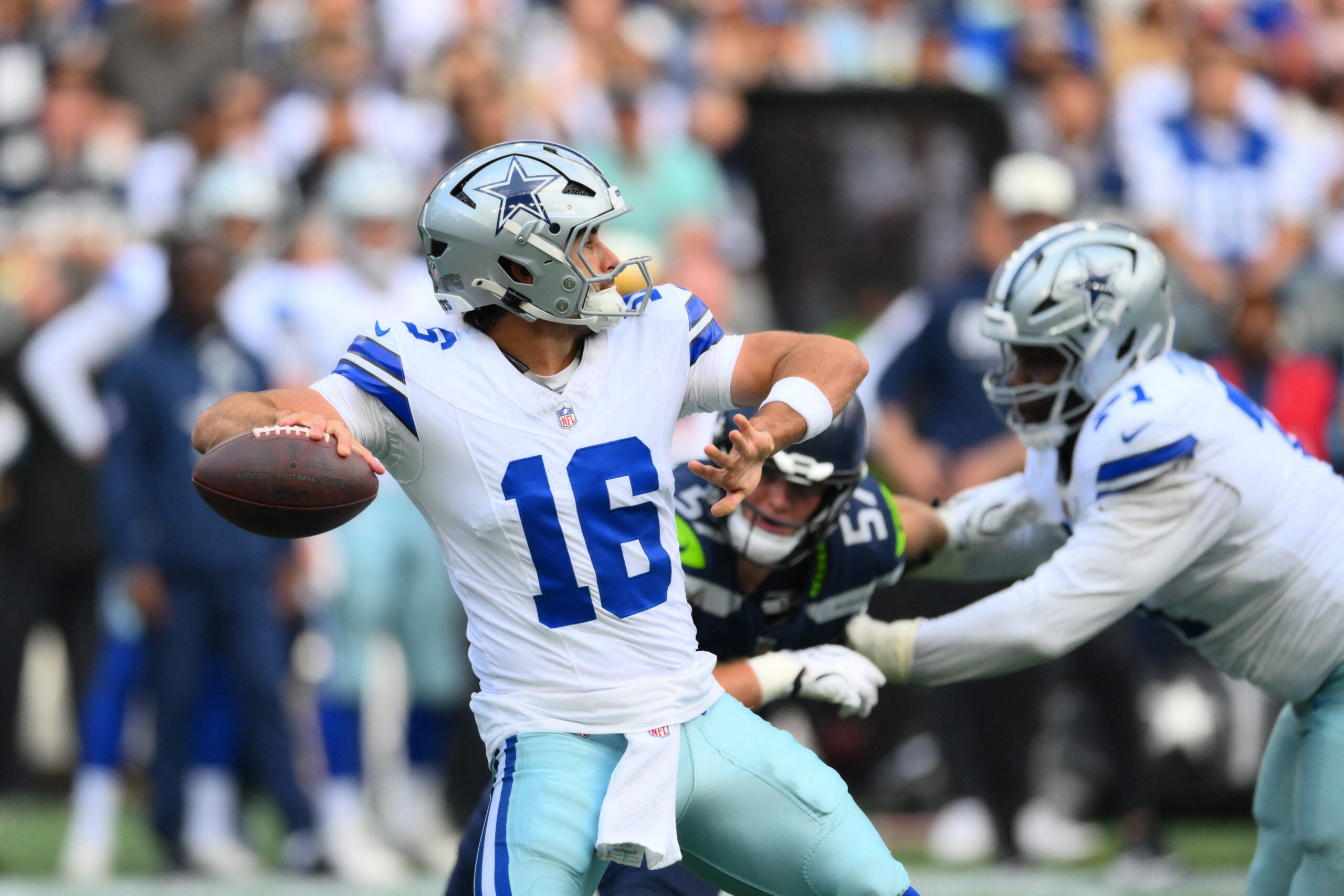 Aug 15, 2026; Seattle, Washington, USA; Dallas Cowboys quarterback Sam Howell (16) passes the ball against the Seattle Seahawks during the first half at Lumen Field.