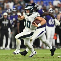 Aug 15, 2026; Baltimore, Maryland, USA; Philadelphia Eagles quarterback Cole Payton (10) carries the ball for a gain in the second half against the Baltimore Ravens at M&T Bank Stadium.