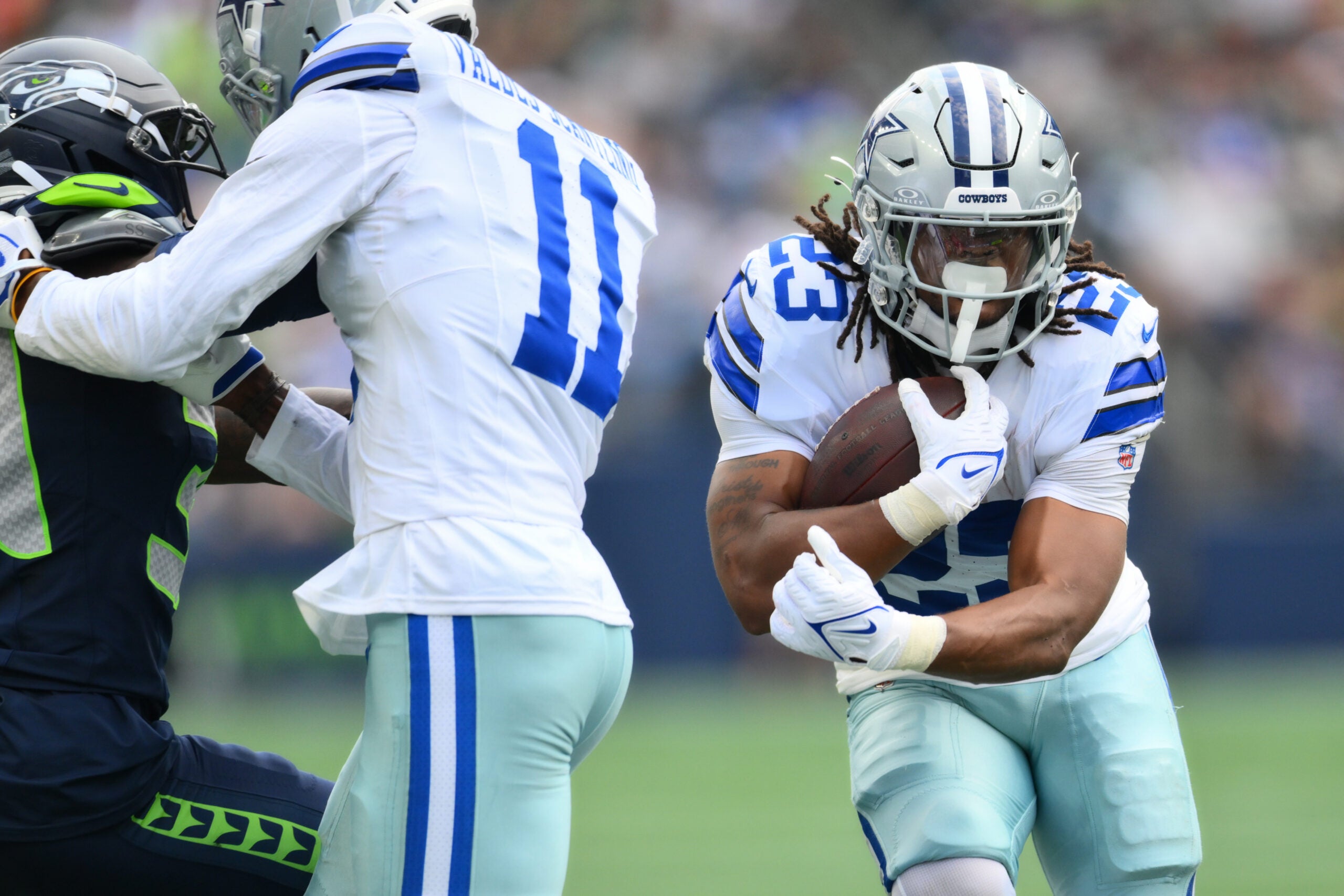 Aug 15, 2026; Seattle, Washington, USA; Dallas Cowboys running back Jaydon Blue (23) carries the ball against the Seattle Seahawks during the game at Lumen Field.