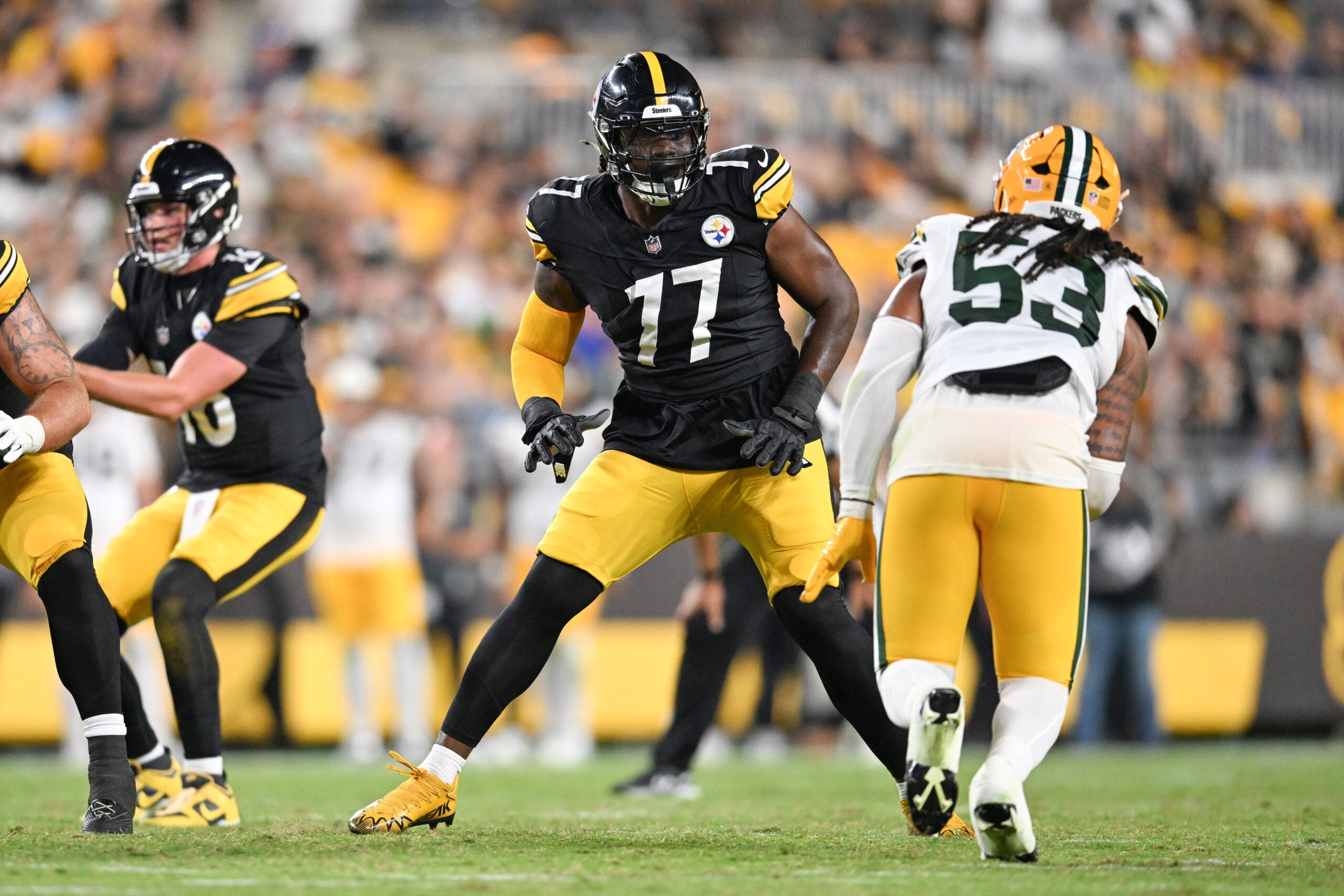 Aug 13, 2026; Pittsburgh, Pennsylvania, USA; Pittsburgh Steelers offensive tackle Broderick Jones (77) looks to block Green Bay Packers defensive end Arron Mosby (53) during the second half at Acrisure Stadium.
